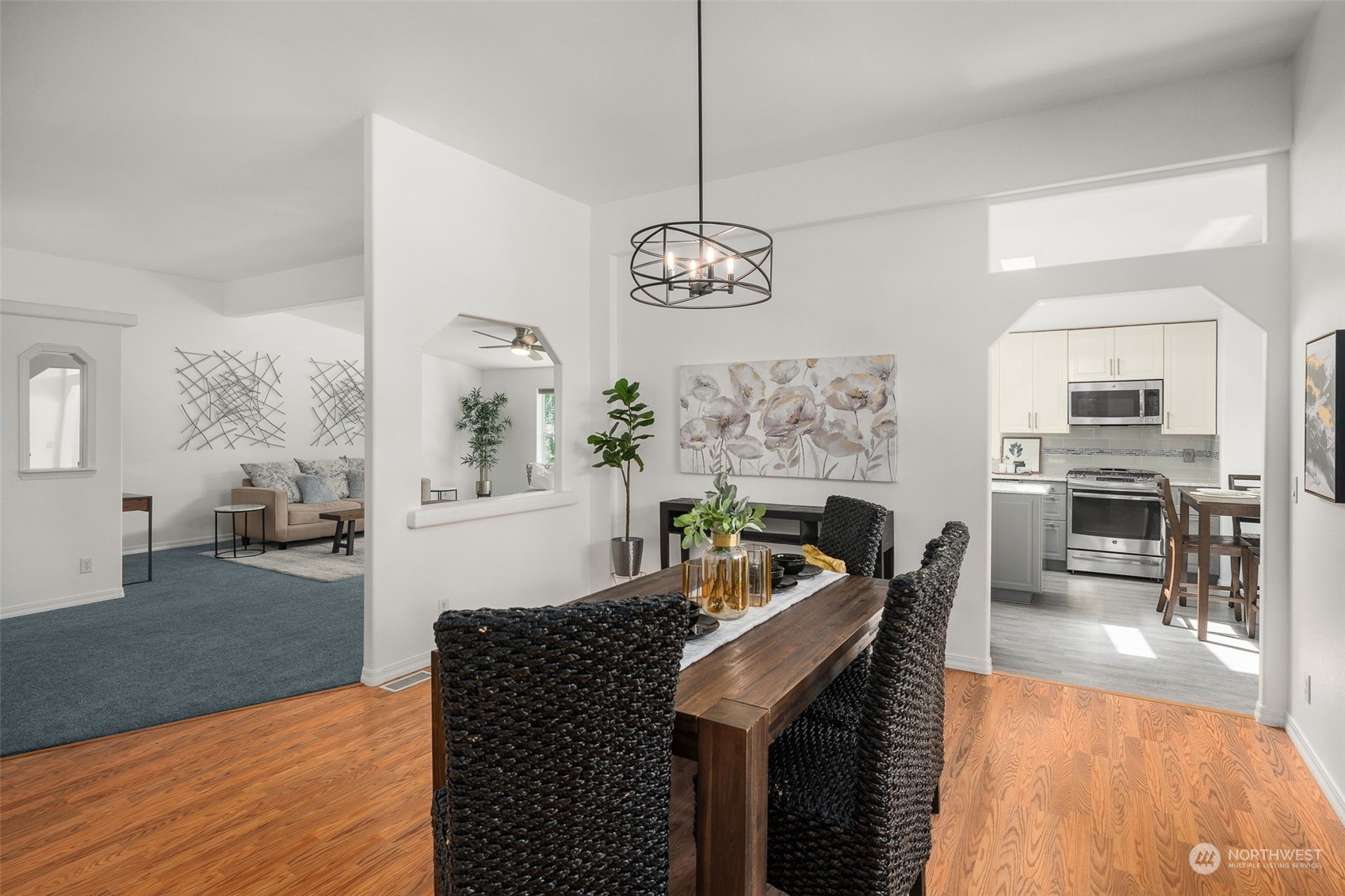 30216 Thomas Road Southeast Kent, WA 98042 - Photo 11 of 37 a living room with fireplace furniture and a chandelier