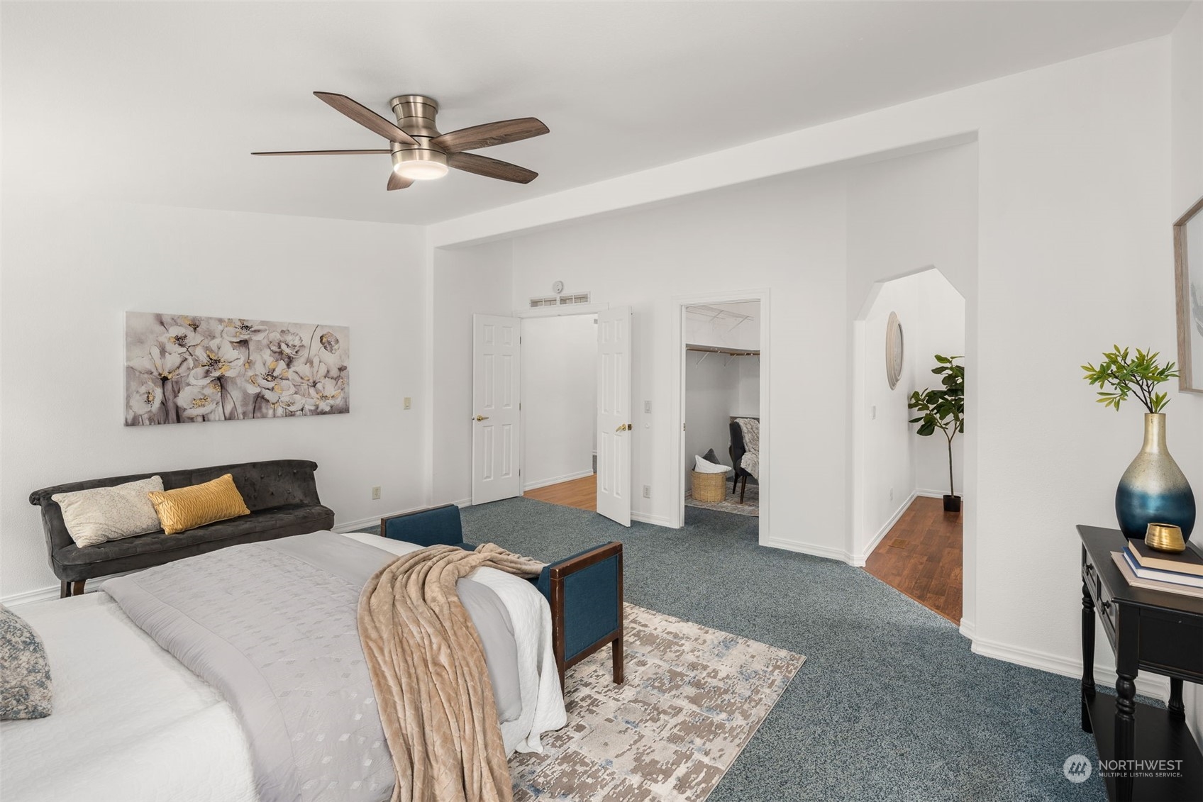 30216 Thomas Road Southeast Kent, WA 98042 - Photo 16 of 37 a bedroom with a bed and a chandelier