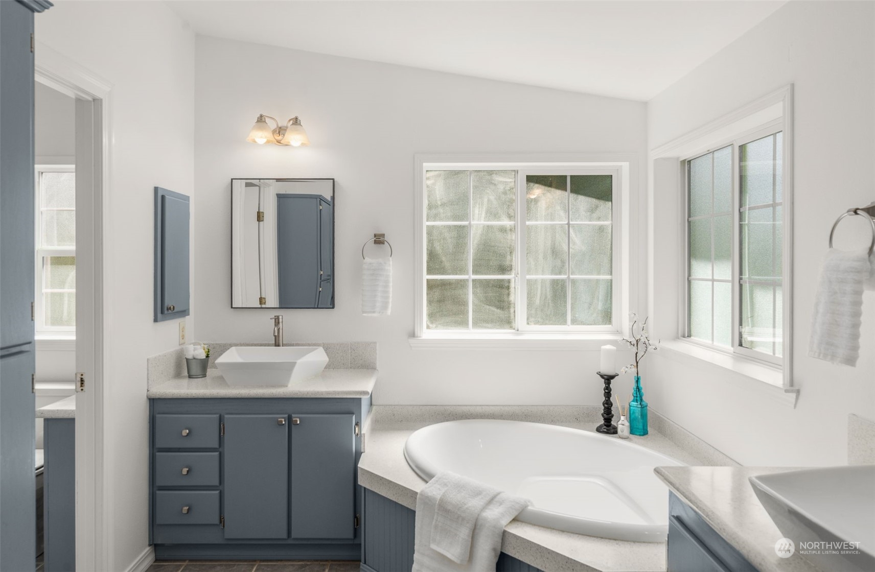 30216 Thomas Road Southeast Kent, WA 98042 - Photo 20 of 37 a bathroom with a granite countertop sink and a mirror