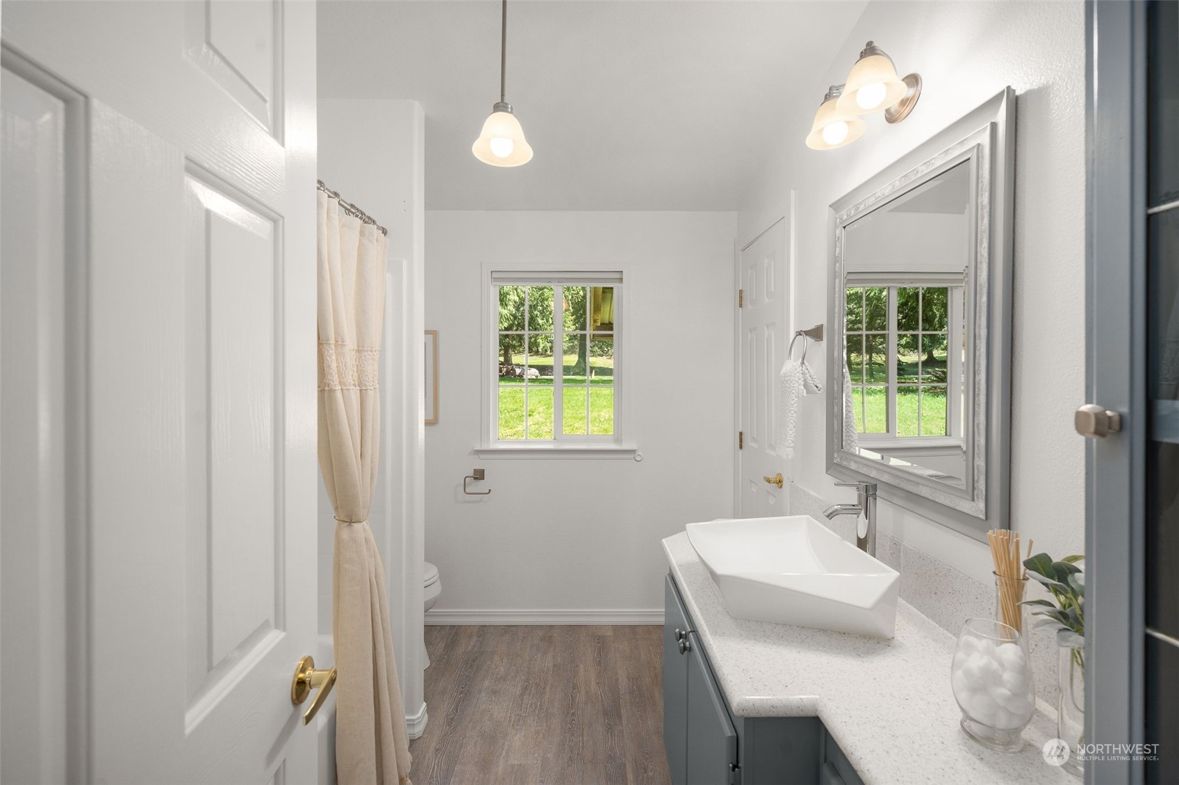 30216 Thomas Road Southeast Kent, WA 98042 - Photo 23 of 37 a bathroom with a sink a mirror and a bathtub