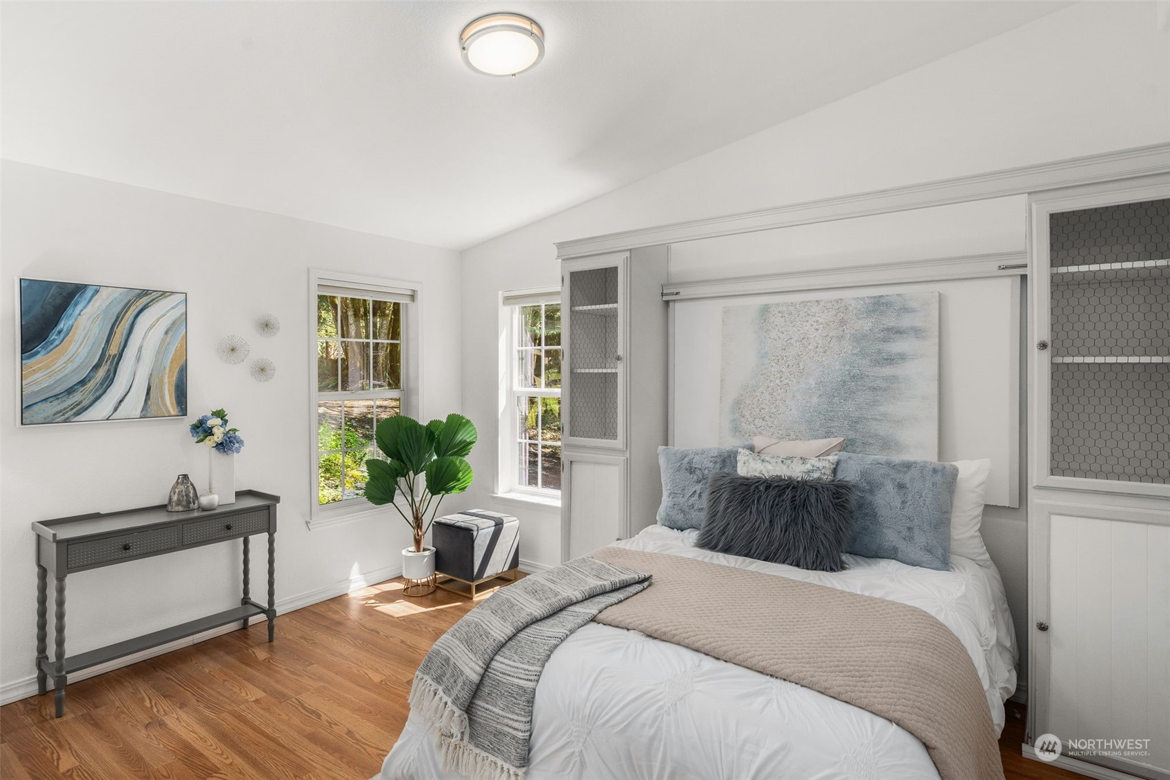 30216 Thomas Road Southeast Kent, WA 98042 - Photo 25 of 37 a bedroom with a bed and wooden floor