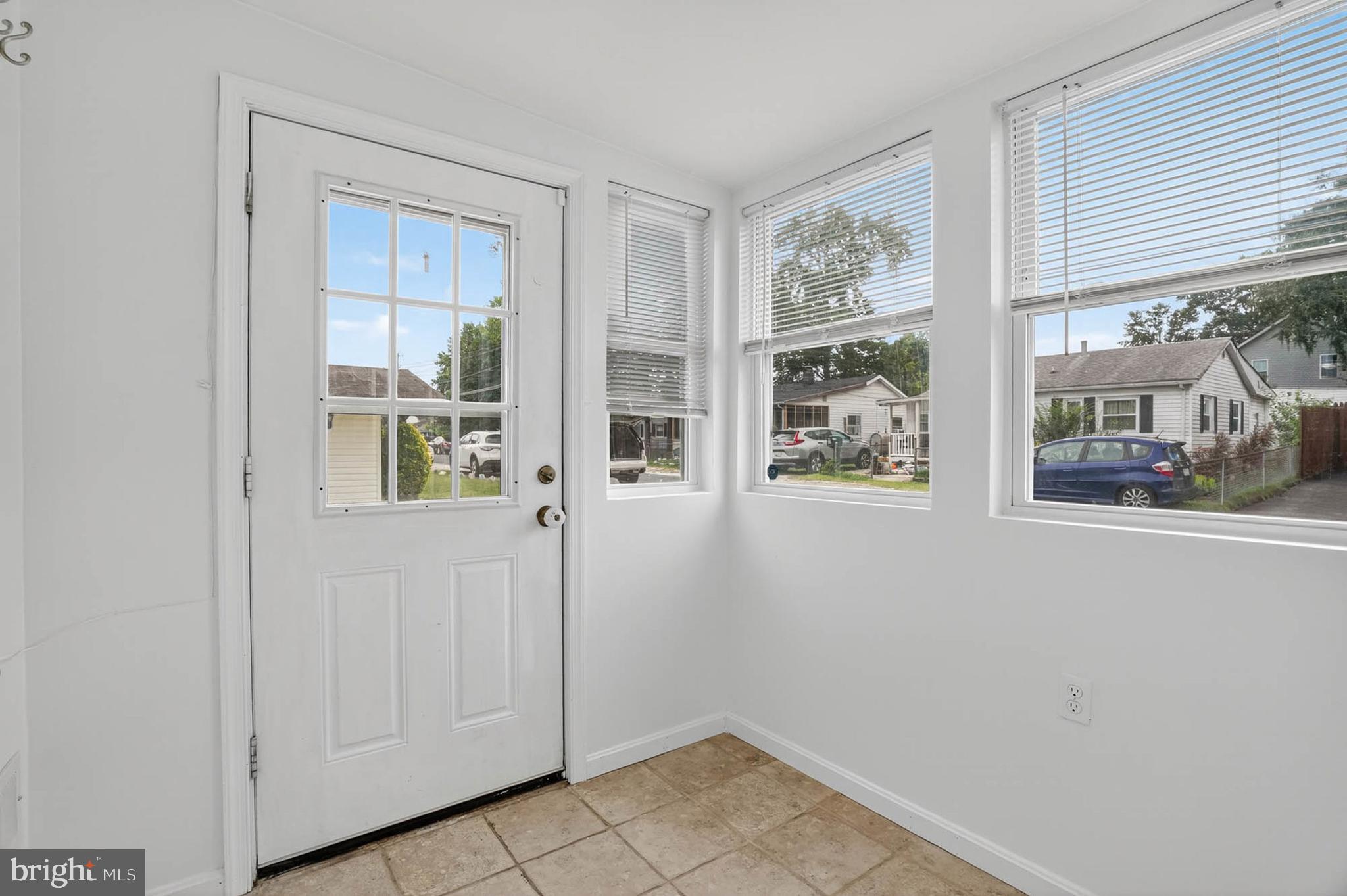 1307 2nd Road Baltimore, MD 21220 - Photo 4 of 25 a view of an entryway with wooden floor and a window