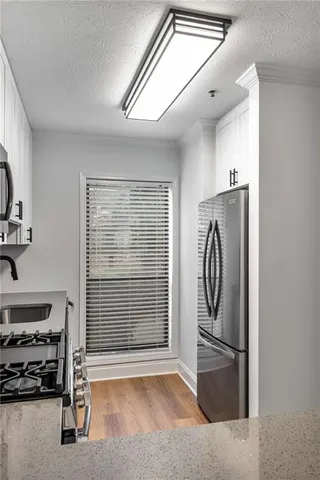 a bathroom with a sink a mirror and a shower