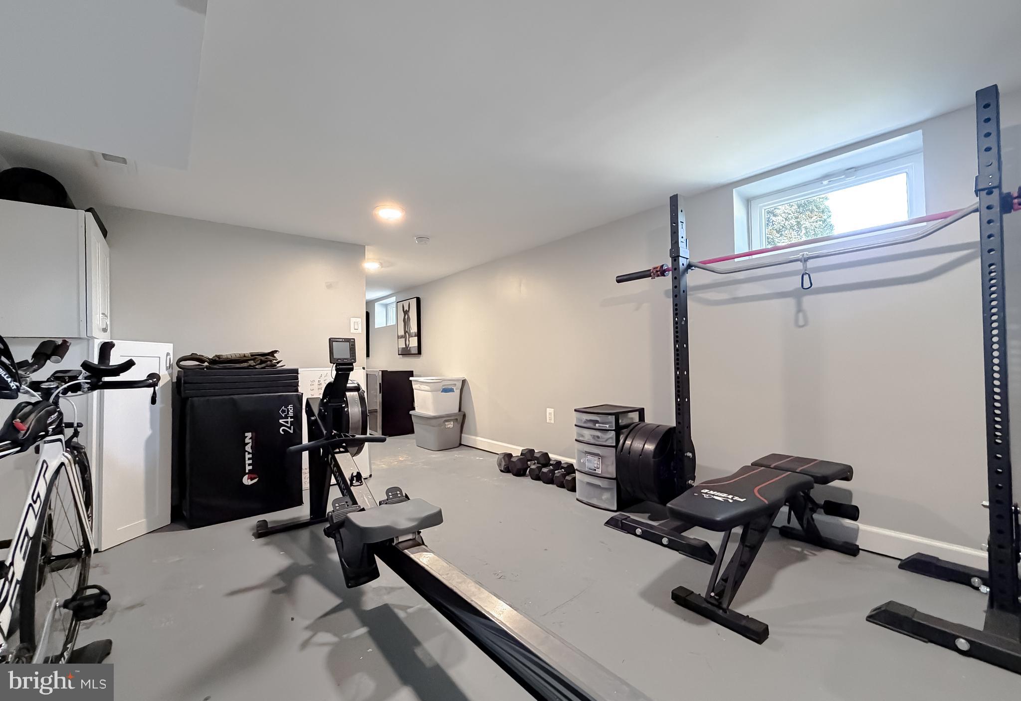 4985 Solomons Island Road Huntingtown, MD 20639 - Photo 33 of 50 a room with gym equipment and a window