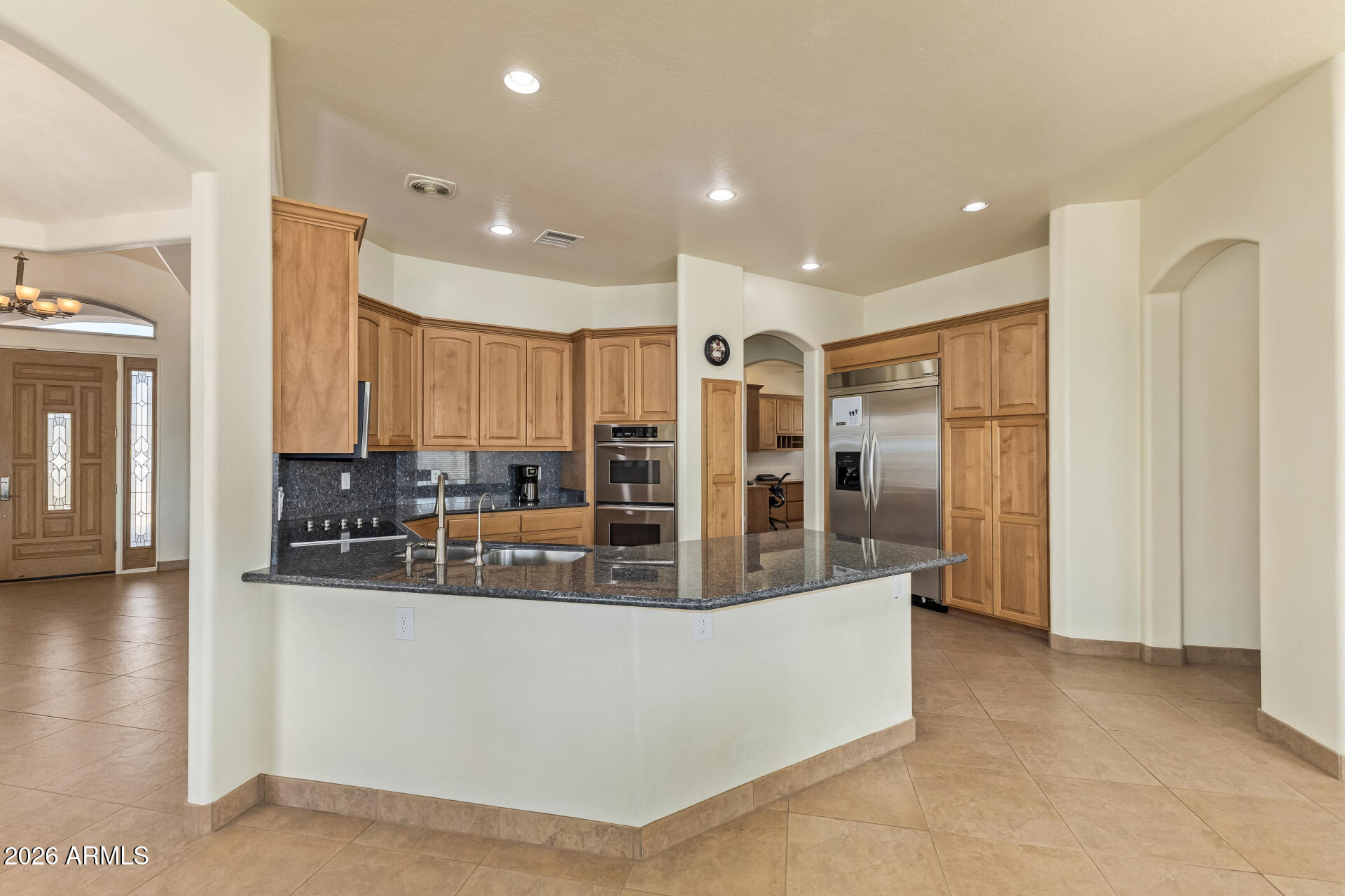 16037 West Wade Lane Goodyear, AZ 85338 - Photo 19 of 67 a view of kitchen island with stainless steel appliances