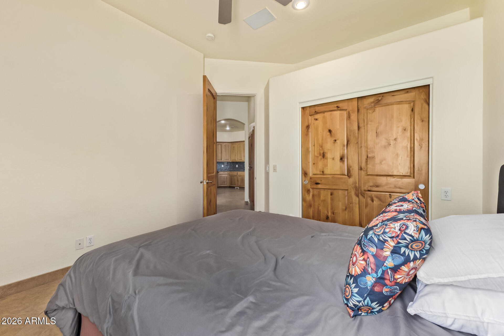 16037 West Wade Lane Goodyear, AZ 85338 - Photo 34 of 67 a bedroom with a bed and a window