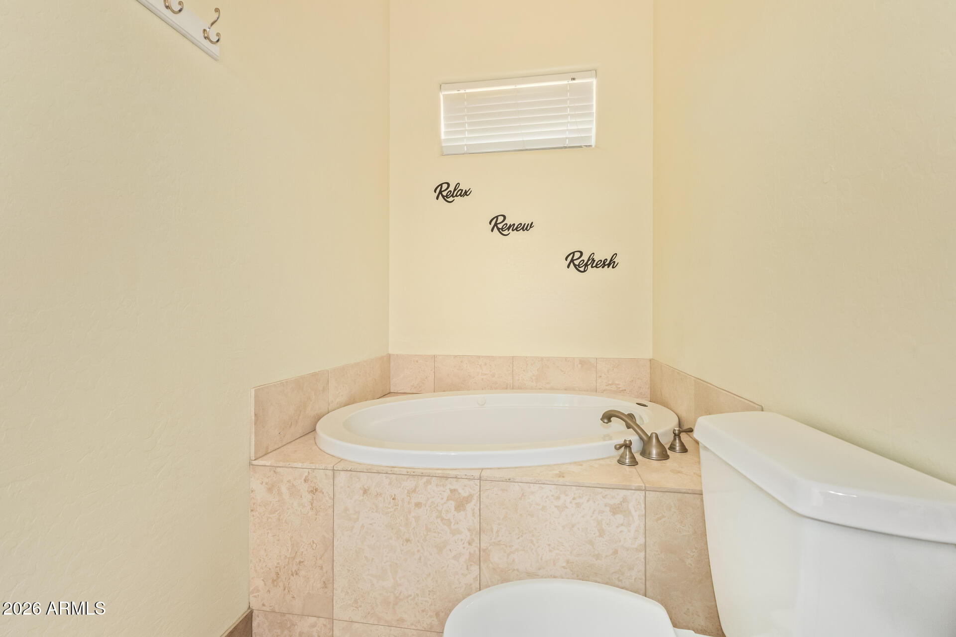 16037 West Wade Lane Goodyear, AZ 85338 - Photo 40 of 67 a bath room with a toilet