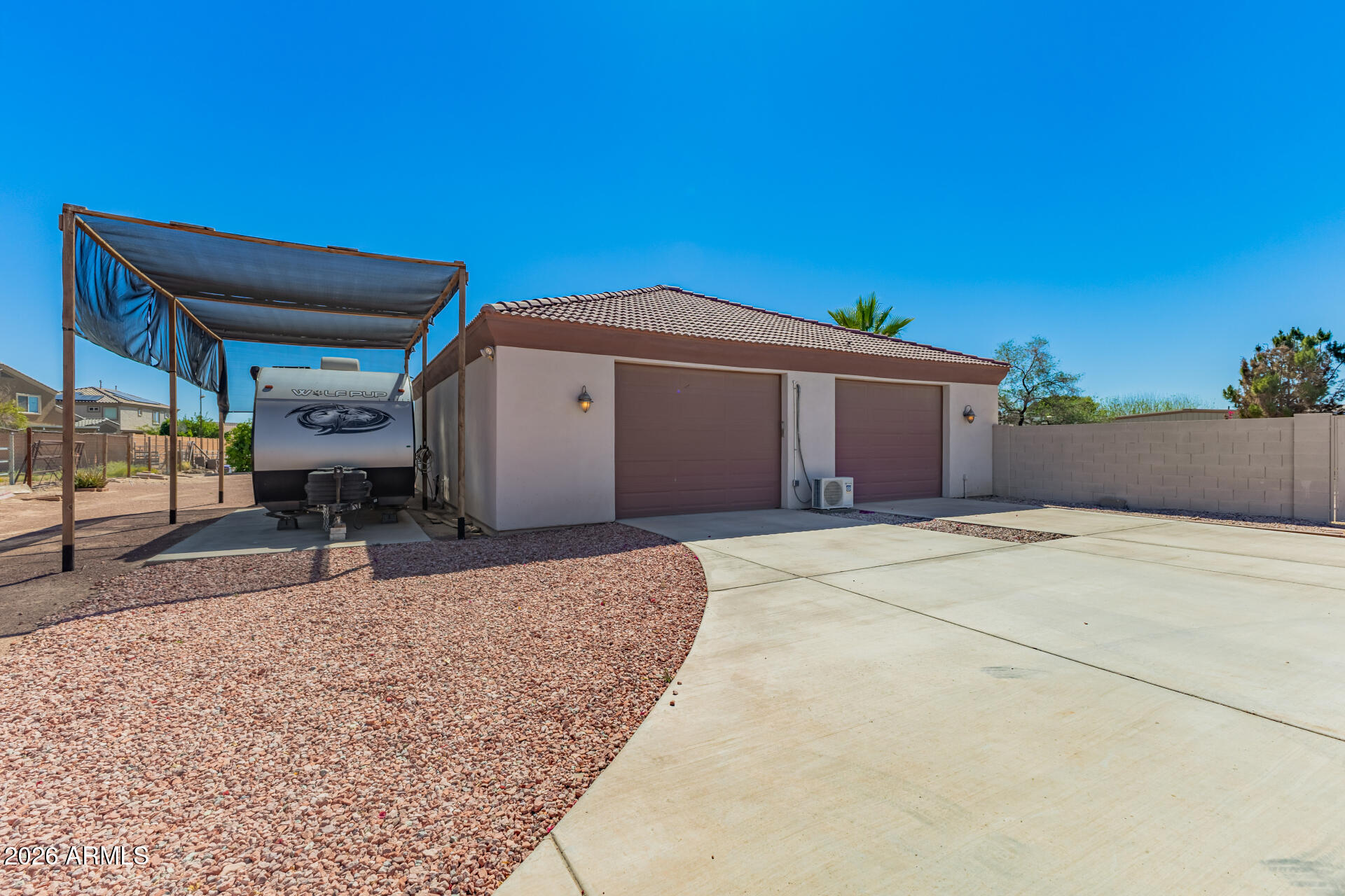 16037 West Wade Lane Goodyear, AZ 85338 - Photo 52 of 67 a front view of a house with a garage