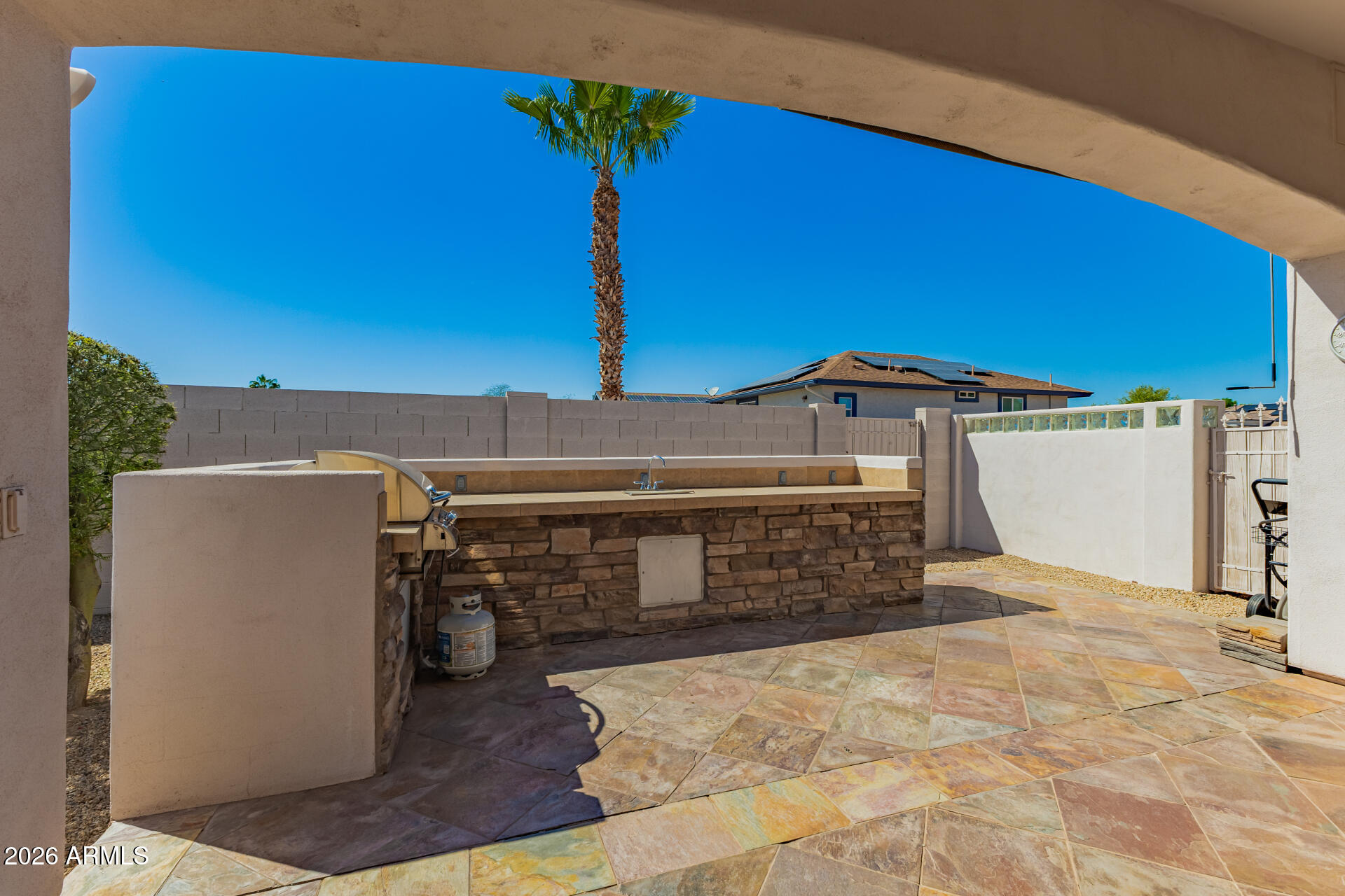 16037 West Wade Lane Goodyear, AZ 85338 - Photo 55 of 67 a view of a house with a yard