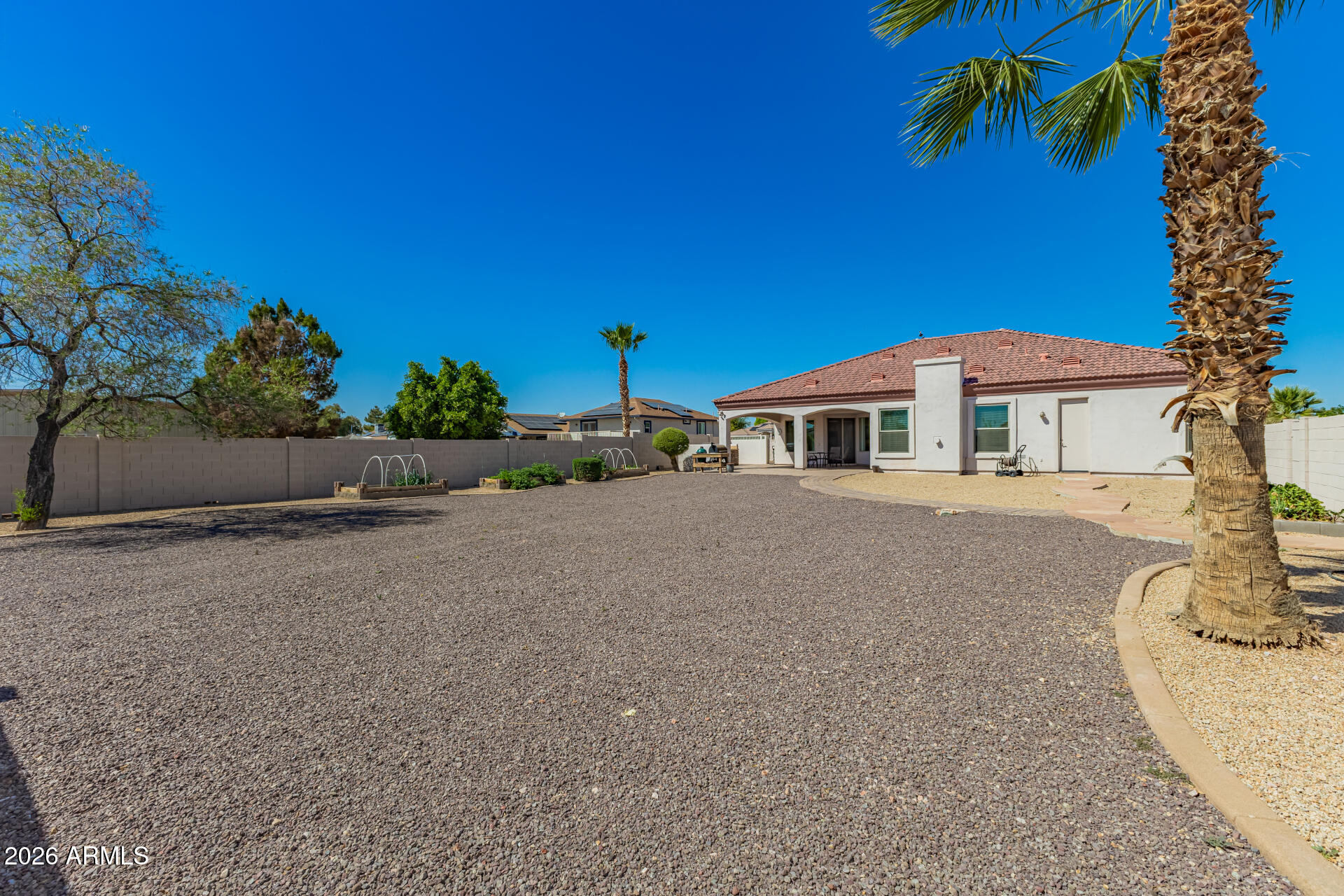 16037 West Wade Lane Goodyear, AZ 85338 - Photo 59 of 67 front view of a house with a street