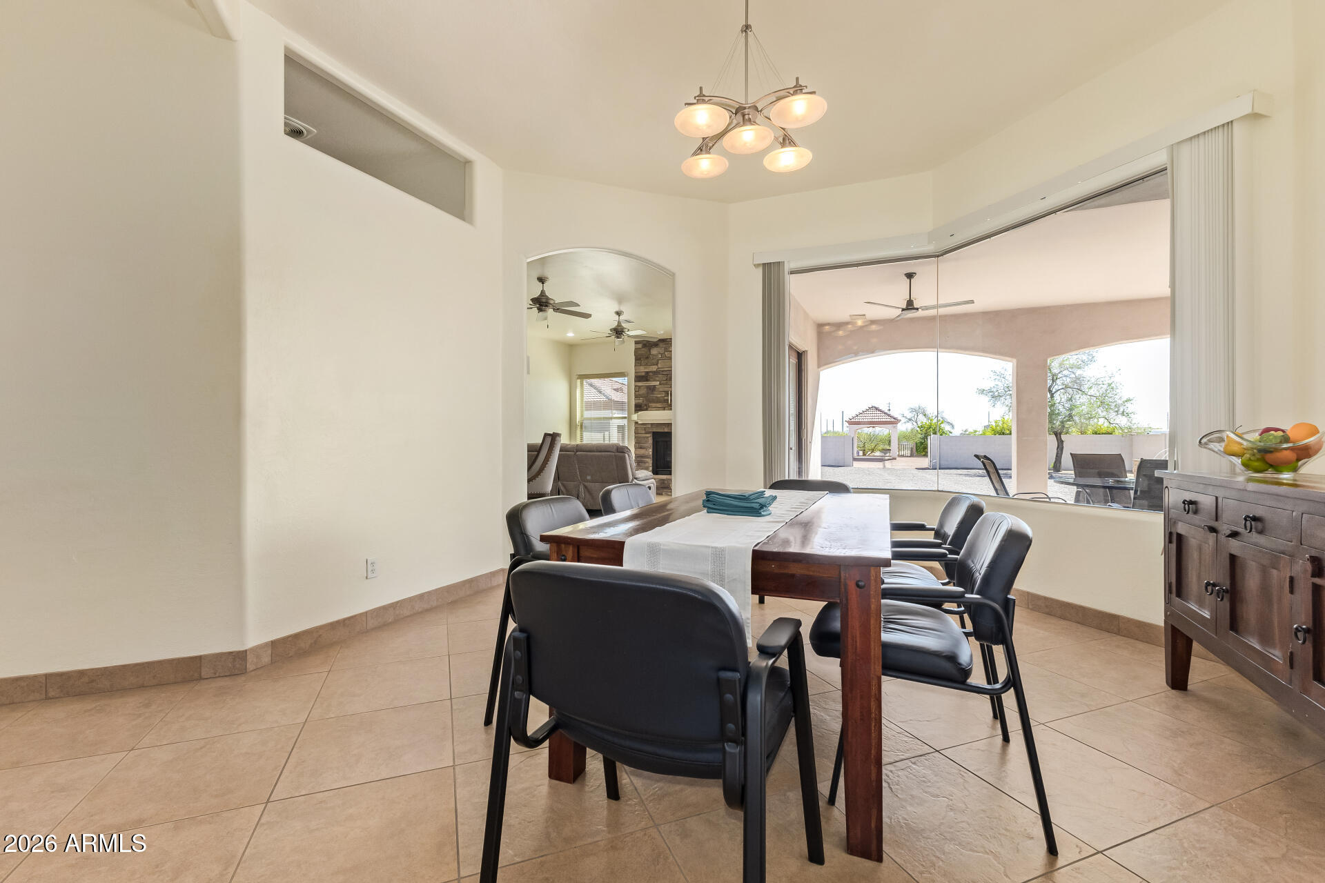 16037 West Wade Lane Goodyear, AZ 85338 - Photo 10 of 67 a view of a dining room with furniture window and outside view