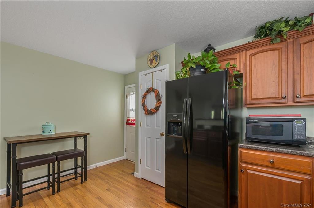 54 Souther Road Fletcher, NC 28732 - Photo 14 of 40 a kitchen with stainless steel appliances granite countertop a refrigerator and a stove top oven