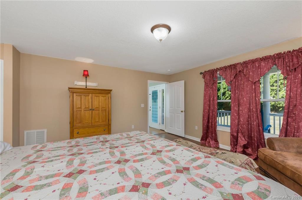 54 Souther Road Fletcher, NC 28732 - Photo 17 of 40 a bedroom with a bed and a window