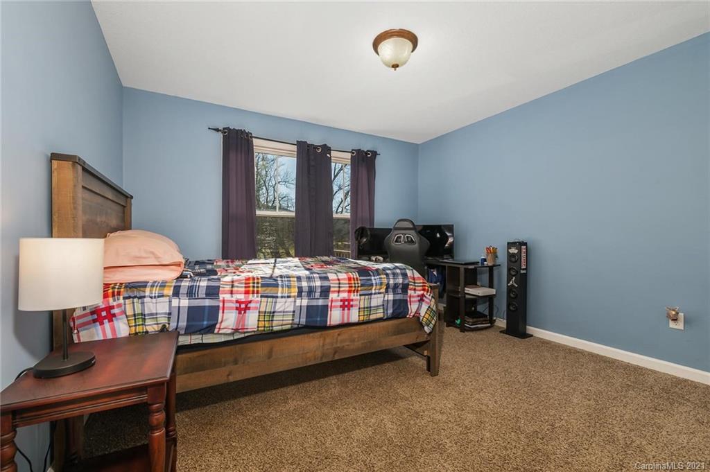 54 Souther Road Fletcher, NC 28732 - Photo 21 of 40 a bedroom with furniture and window