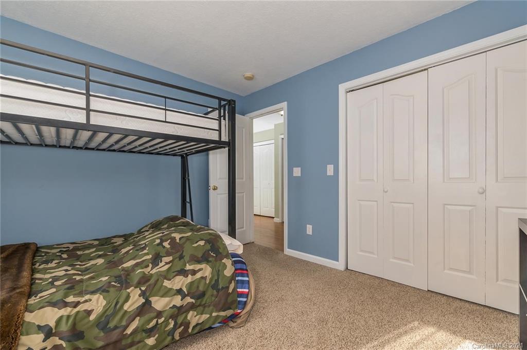 54 Souther Road Fletcher, NC 28732 - Photo 23 of 40 a bedroom with a bed and a window