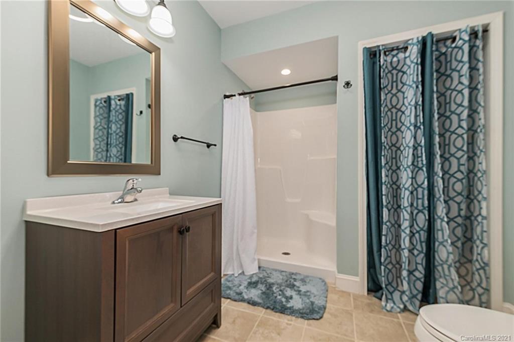 54 Souther Road Fletcher, NC 28732 - Photo 31 of 40 a bathroom with a sink toilet and shower