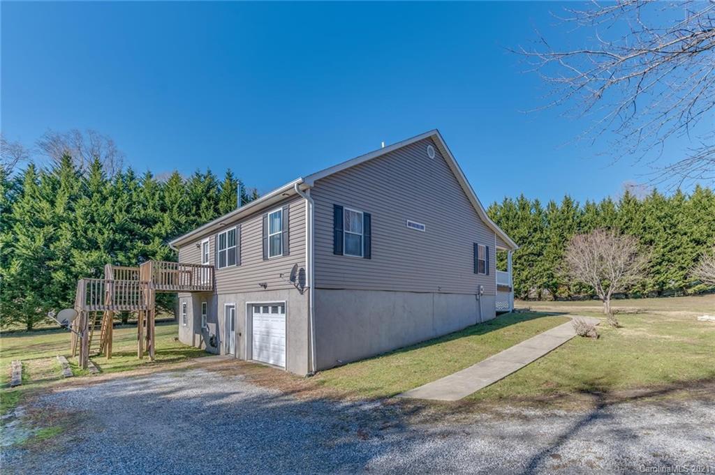 54 Souther Road Fletcher, NC 28732 - Photo 38 of 40 a view of a house with backyard and trees