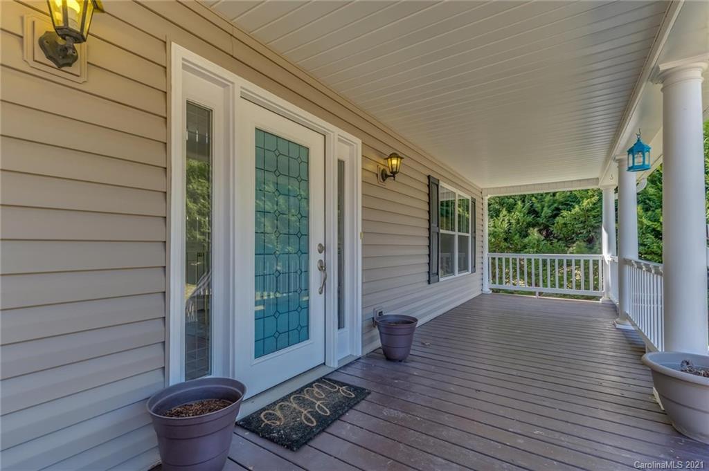 54 Souther Road Fletcher, NC 28732 - Photo 6 of 40 a view of a deck with wooden floor and a swing chair