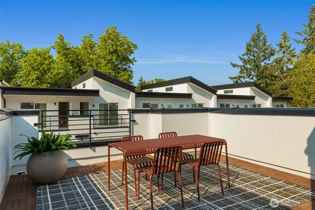 a view of a chairs and table in patio