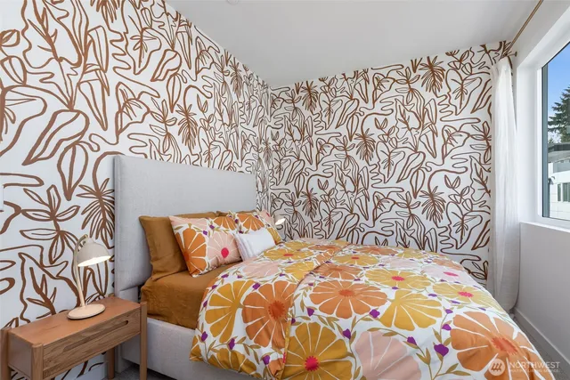 a bedroom with a bed and a lamp