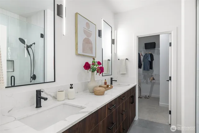 a bathroom with a double vanity sink mirror and double