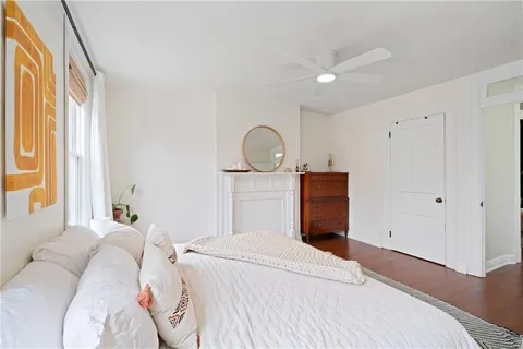 a bedroom with a bed and a window