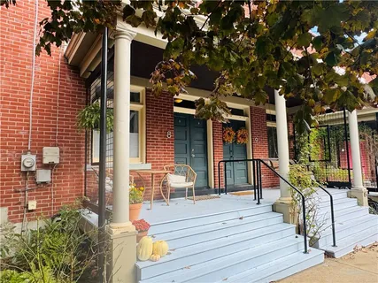 a balcony view with a seating space