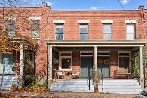 a view of a building with outdoor seating