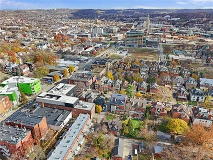 a view of a patio with table and chairs and potted plants