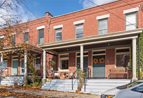 a view of a building with sitting area