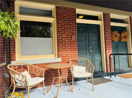 a patio with table and chairs