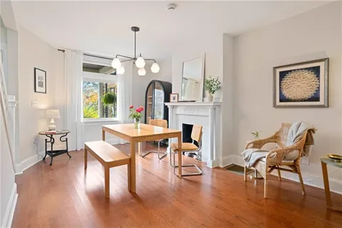 a view of a dining room with furniture window and wooden floor