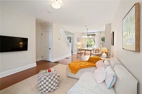 a bedroom with furniture and a flat screen tv