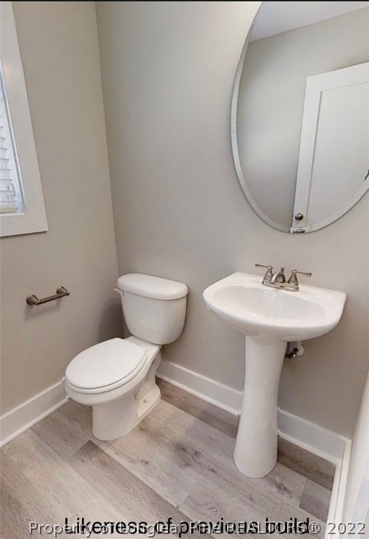 256 Crupper Lane Raeford, NC 28376 - Photo 12 of 30 a white toilet sitting next to a white sink