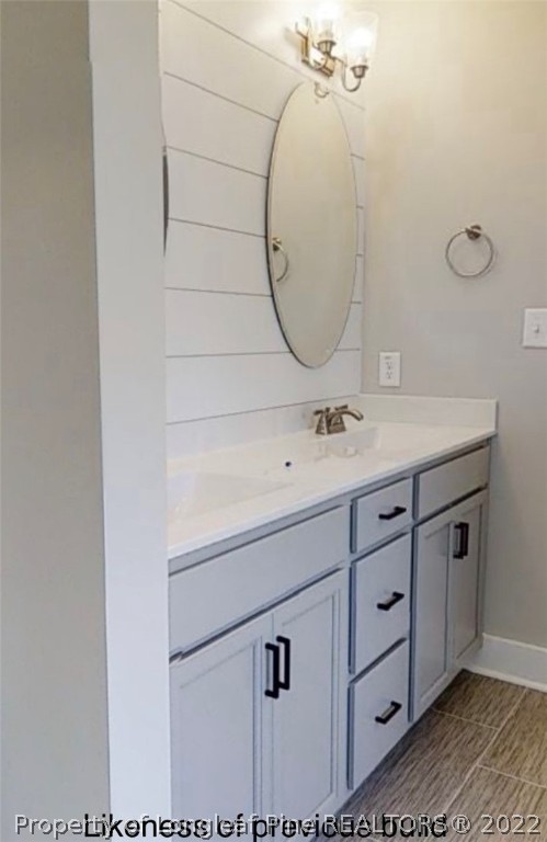256 Crupper Lane Raeford, NC 28376 - Photo 15 of 30 a bathroom with a sink vanity and a mirror
