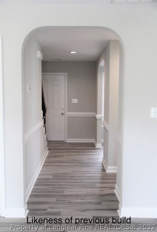 256 Crupper Lane Raeford, NC 28376 - Photo 16 of 30 a view of a hallway with wooden floor