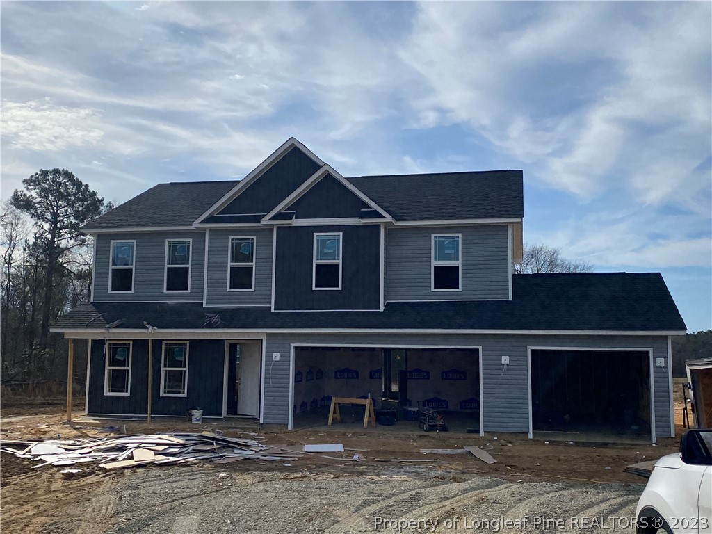 256 Crupper Lane Raeford, NC 28376 - Photo 18 of 30 a front view of a house with garden