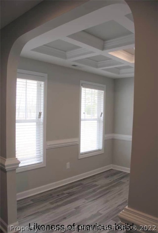 256 Crupper Lane Raeford, NC 28376 - Photo 22 of 30 an empty room with wooden floor and windows