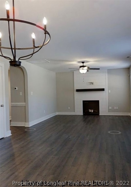 256 Crupper Lane Raeford, NC 28376 - Photo 24 of 30 a view of empty room with wooden floor and fan