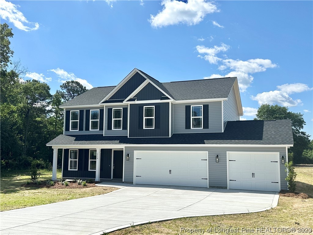 256 Crupper Lane Raeford, NC 28376 - Photo 29 of 30 a front view of a house with a garden
