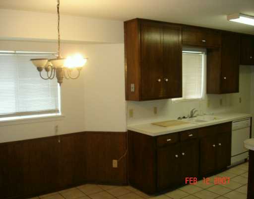 4533 Stonegate Way Corpus Christi, TX 78411 - Photo 3 of 10 a bathroom with a sink and a mirror