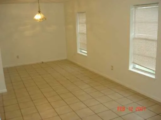 a backyard of a house with lots of green space and lake view