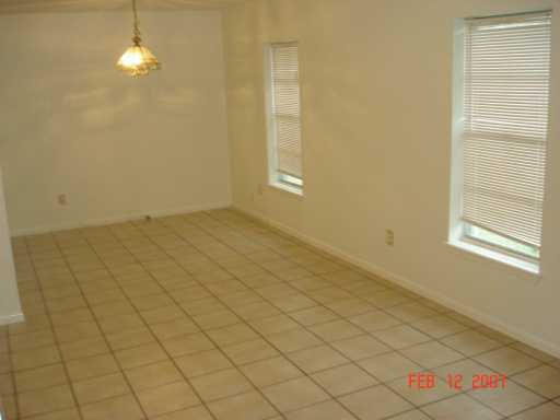 4533 Stonegate Way Corpus Christi, TX 78411 - Photo 8 of 10 en empty room with windows