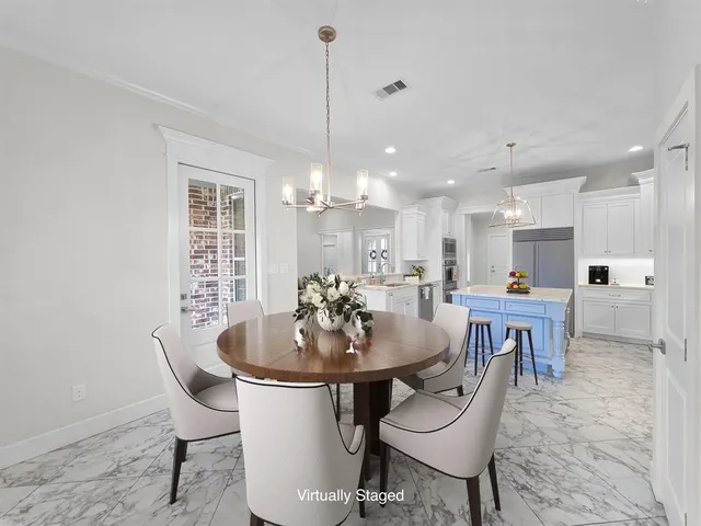 a dining room with furniture and window