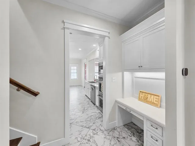 a view of kitchen with furniture and refrigerator