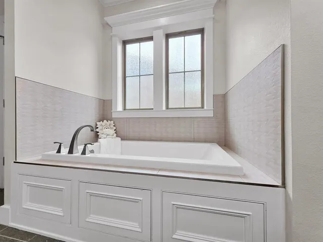 a bathroom with a sink and a bathtub