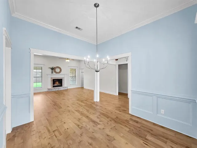a view of a kitchen with a sink and a refrigerator wooden floor