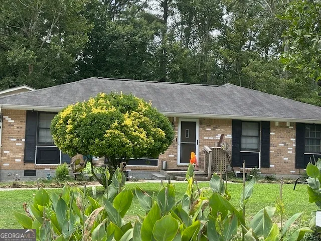 front view of a house with a yard