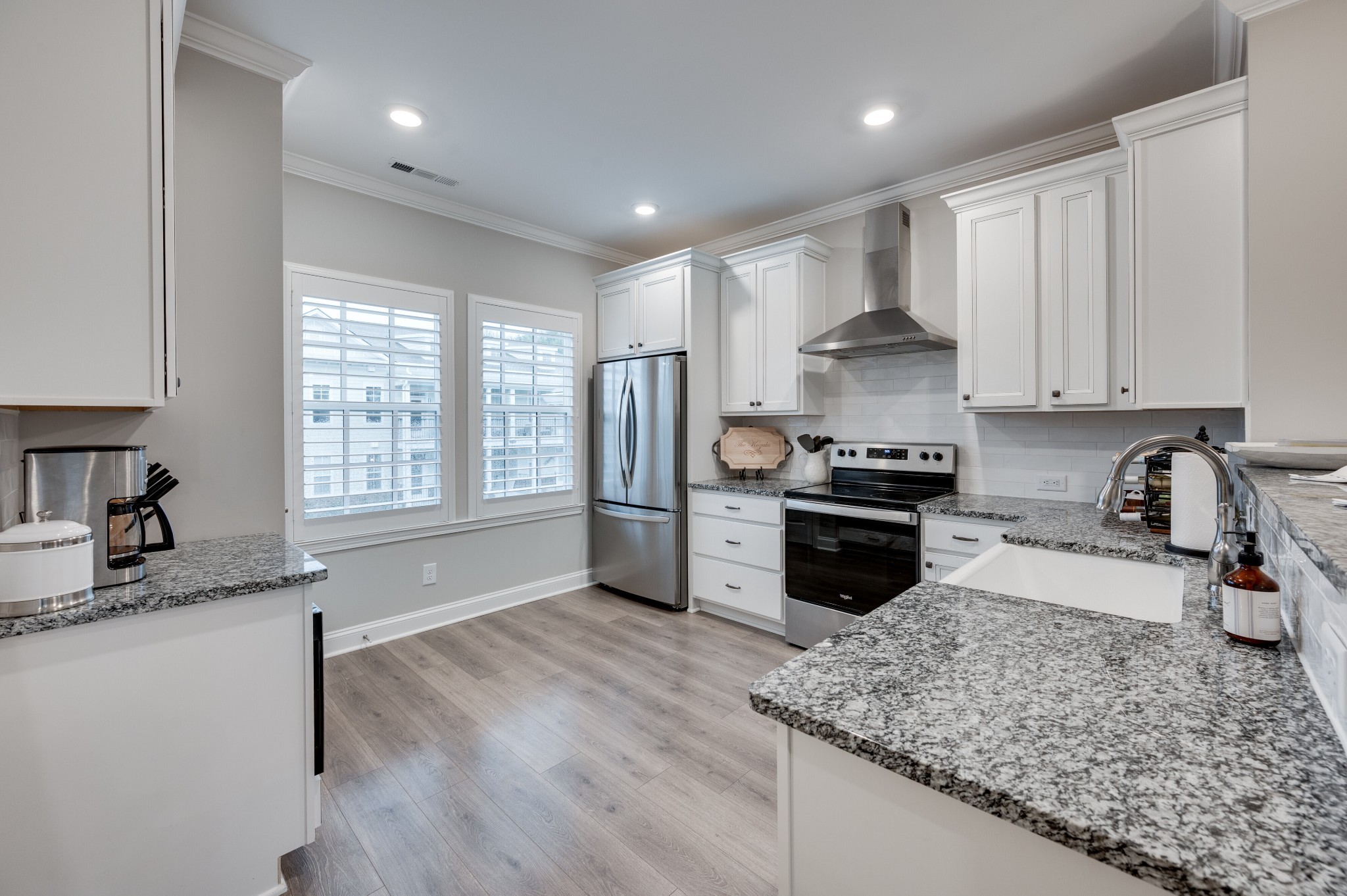 3106 Patcham Drive Nolensville, TN 37135 - Photo 7 of 27 a kitchen with granite countertop a stove sink and cabinets
