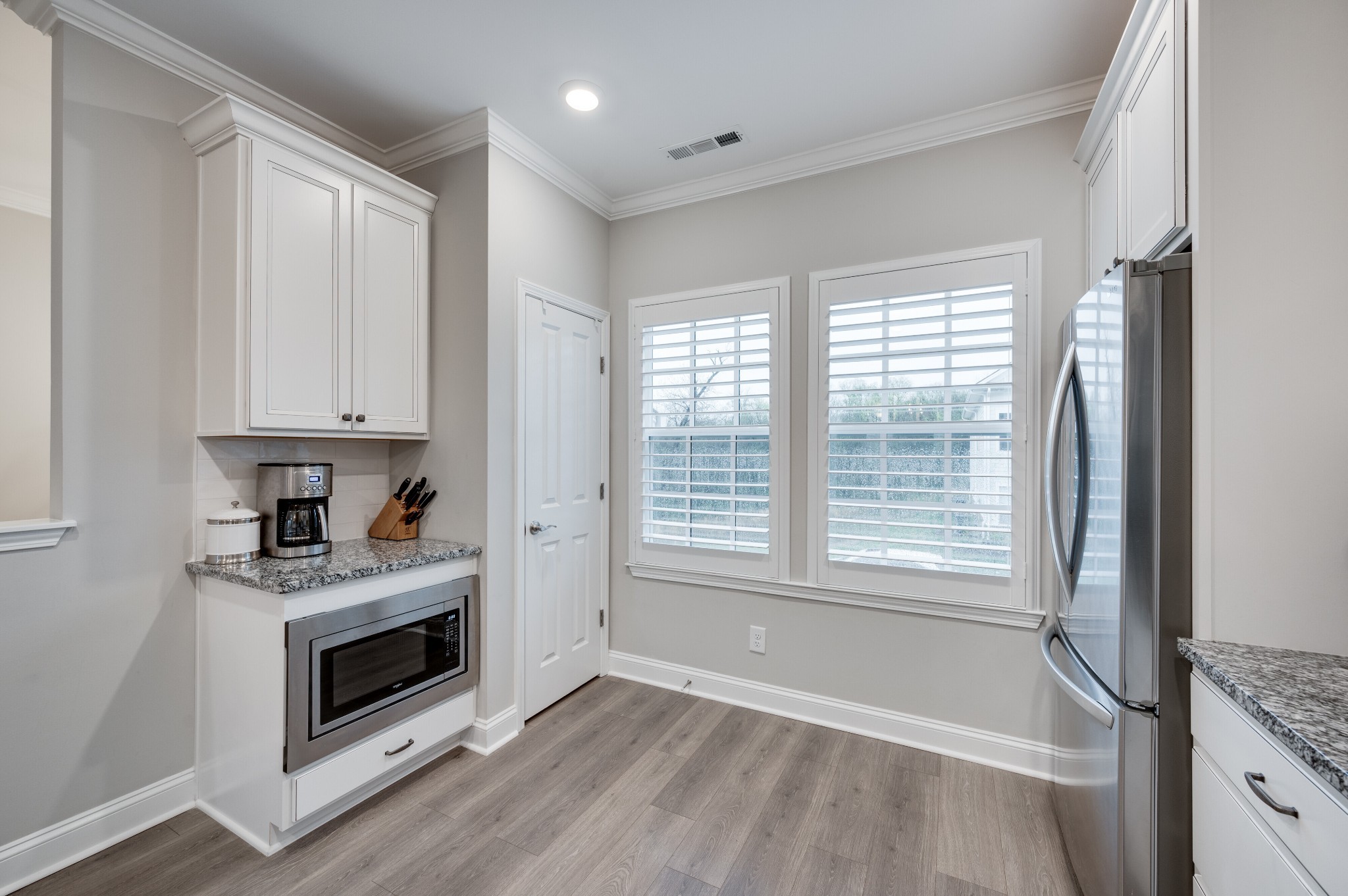 3106 Patcham Drive Nolensville, TN 37135 - Photo 9 of 27 a view of a kitchen with a sink dishwasher and a fireplace